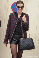 miranda_kerr_style_chanel_fashion_show_chanel_tartan_tweed_jacket_maison_martin_margiela_leather_shorts_isabel_marant_tacy_boots_chanel_chain_around_tote.jpg