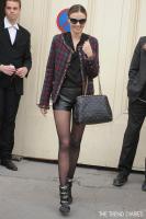miranda_kerr_style_chanel_fashion_show_chanel_tartan_tweed_jacket_maison_martin_margiela_leather_shorts_isabel_marant_tacy_boots_chanel_chain_around_tote_1.jpg