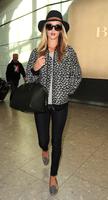 rosie_huntington_whiteley_arrives_at_heatrow_airport_in_london_2.jpg