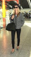 rosie_huntington_whiteley_arrives_at_heatrow_airport_in_london_3.jpg