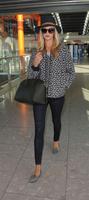 rosie_huntington_whiteley_arrives_at_heatrow_airport_in_london_5.jpg