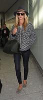 rosie_huntington_whiteley_arrives_at_heatrow_airport_in_london_7.jpg
