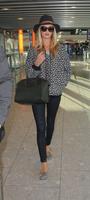 rosie_huntington_whiteley_arrives_at_heatrow_airport_in_london_8.jpg