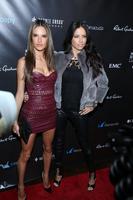 alessandra_ambrosio_and_adriana_lima_11_th_annual_leather_and_laces_party_during_super_bowl_xlvlll_5.jpg