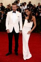 David_Beckham_in_a_Ralph_Lauren_Black_Label_suit_and_Christian_Louboutin_shoes_and_Victoria_Beckham_in_Victoria_Beckham.jpg