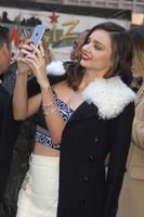 miranda_kerr_swarovski_star_raising_for_2015_rockefeller_center_christmas_tree_in_new_york_city_28.jpg